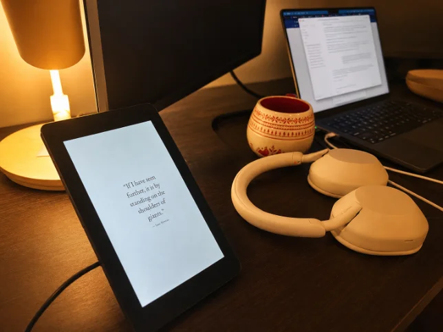 Daily Wisdom display on a bedside table showing a quote
